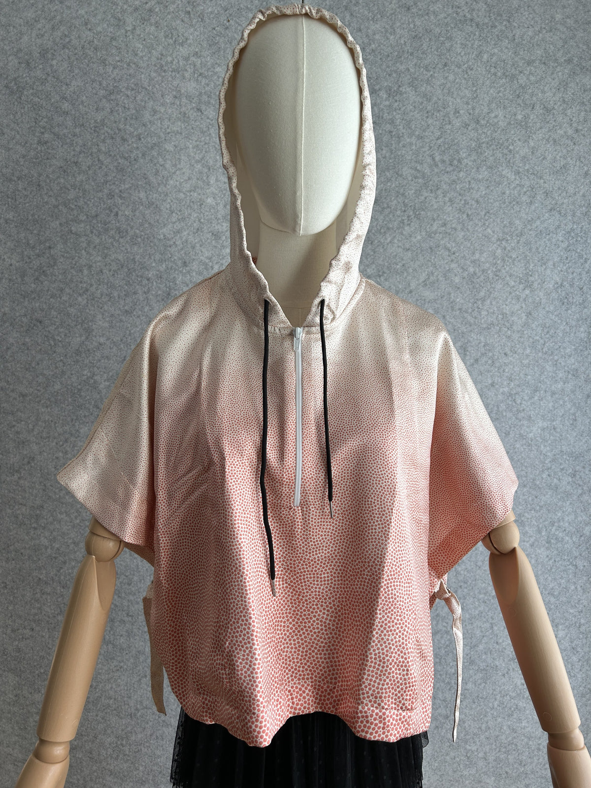 Light pink hooded kimono poncho with tiny coral dots, front view
