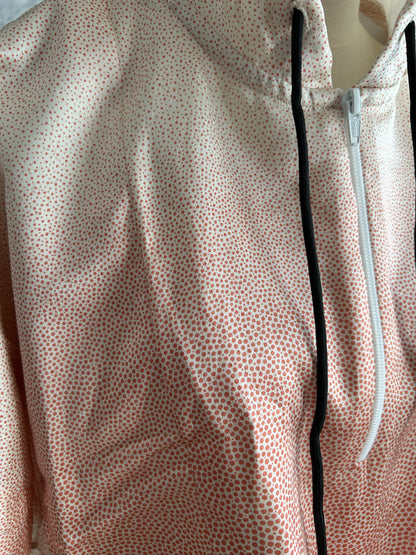 Light pink hooded kimono poncho, detail of dot pattern and white zipper