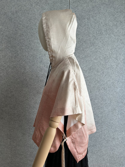 Light pink hooded kimono poncho with tiny coral dots, side view