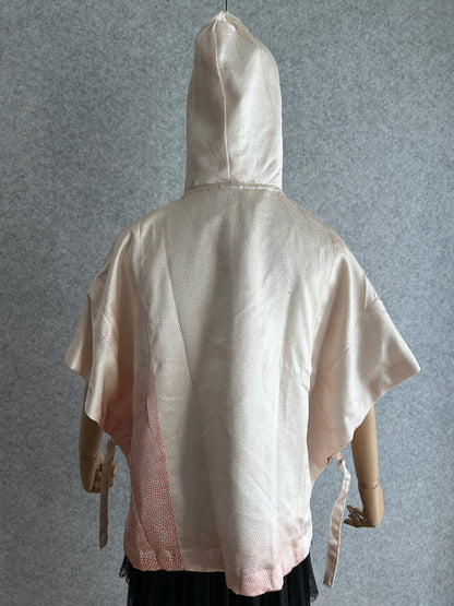 Light pink hooded kimono poncho with tiny coral dots, back view