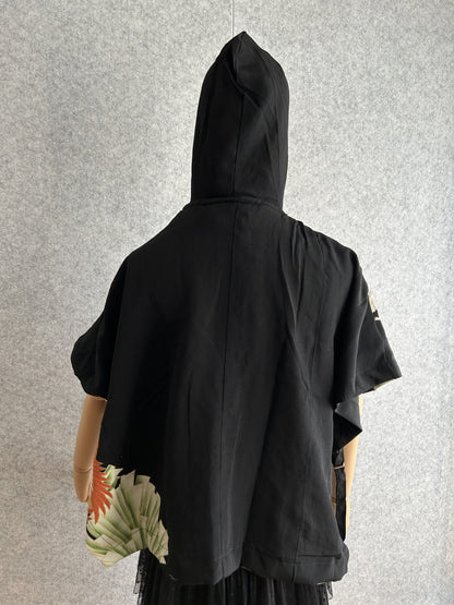 Black hooded kimono poncho with small patterned corner, back view