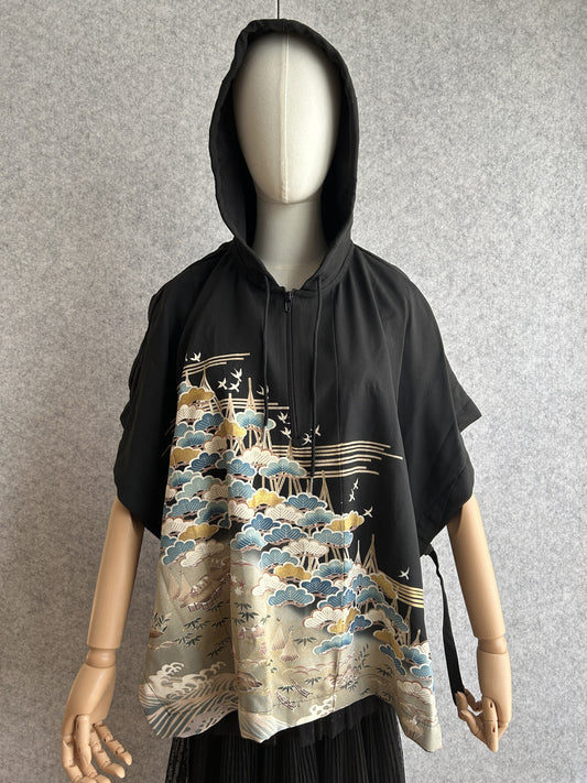 Black hooded kimono poncho with blue and gold pine tree scene, front view