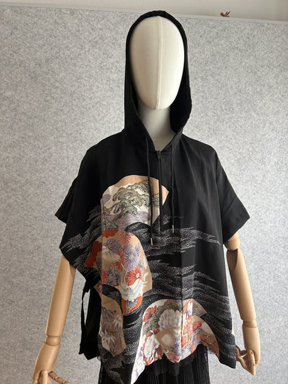 Black hooded kimono poncho with crane and chrysanthemum fan panels, front view