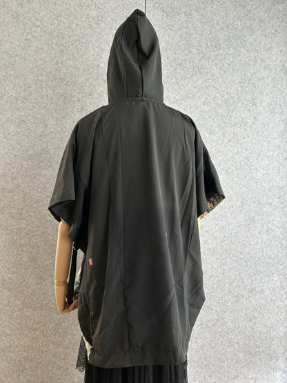Black hooded kimono poncho, mostly plain black, back view