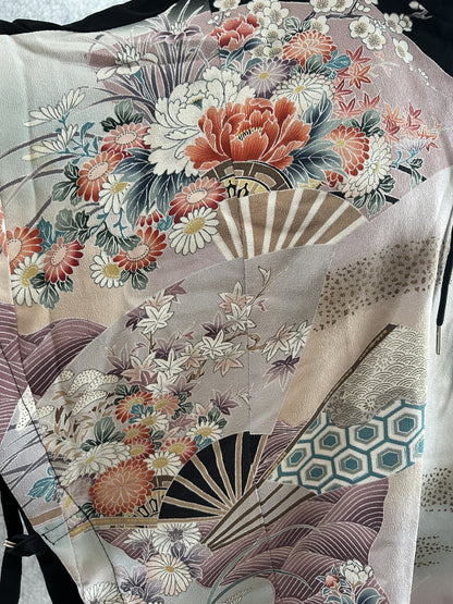 Black hooded kimono poncho, close-up of coral peonies, chrysanthemums and folding fans