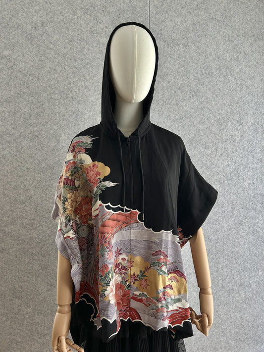 Black hooded kimono poncho with red and lilac floral design, front view