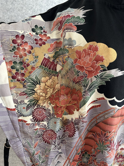 Black hooded kimono poncho, detail of peonies, pine and chrysanthemums on front