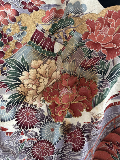 Black hooded kimono poncho, close-up of coral and cream peonies with gold outlines