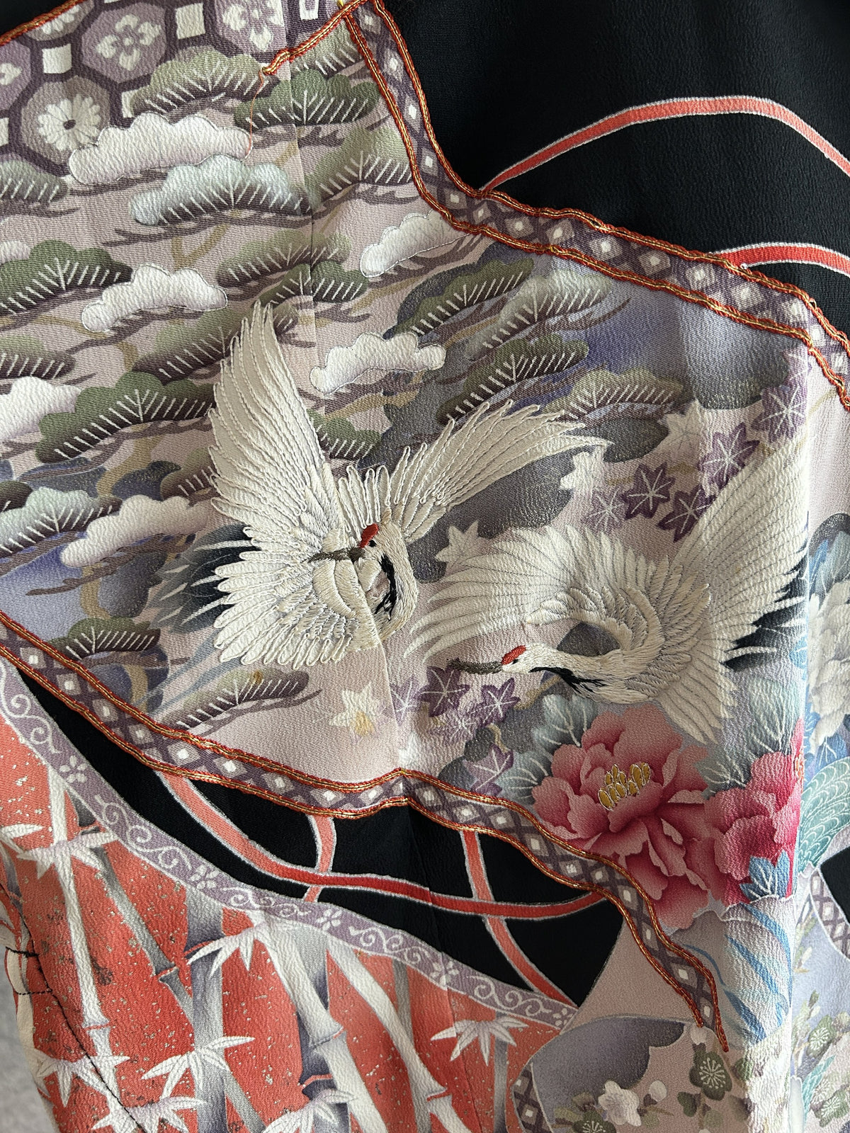 Black hooded kimono poncho, close-up of two white cranes, pine and pink peony