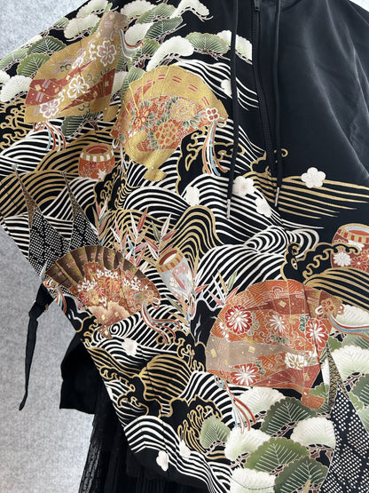 Black hooded kimono poncho, detail of fans, pine and white wave lines