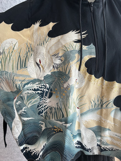 Black hooded kimono poncho, close-up of white cranes, reeds and waves