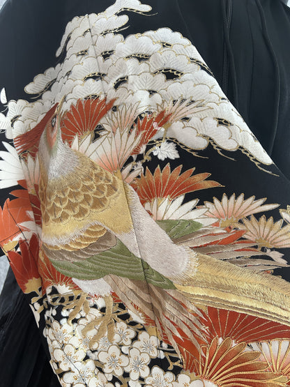 Detail of bird with white pine, orange leaves and white plum blossoms
