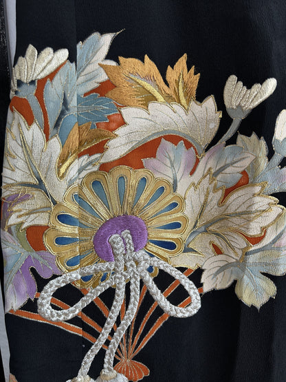 Black kimono skirt with fan, flower and silver cord motif, detail