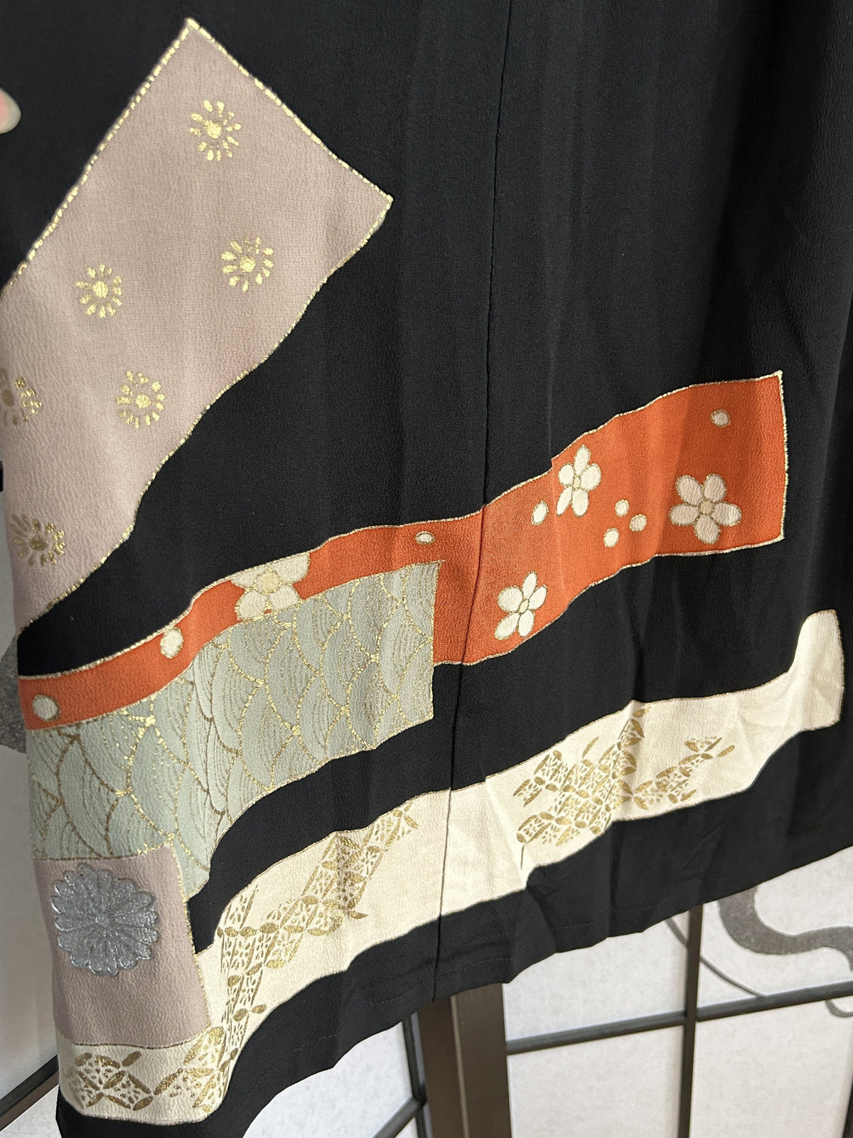 Black kimono skirt back with pink, orange and cream bands, detail