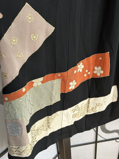 Black kimono skirt back with pink, orange and cream bands, detail