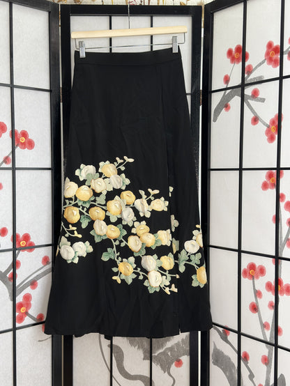 Black high slit kimono skirt with yellow and white blossoms, front view