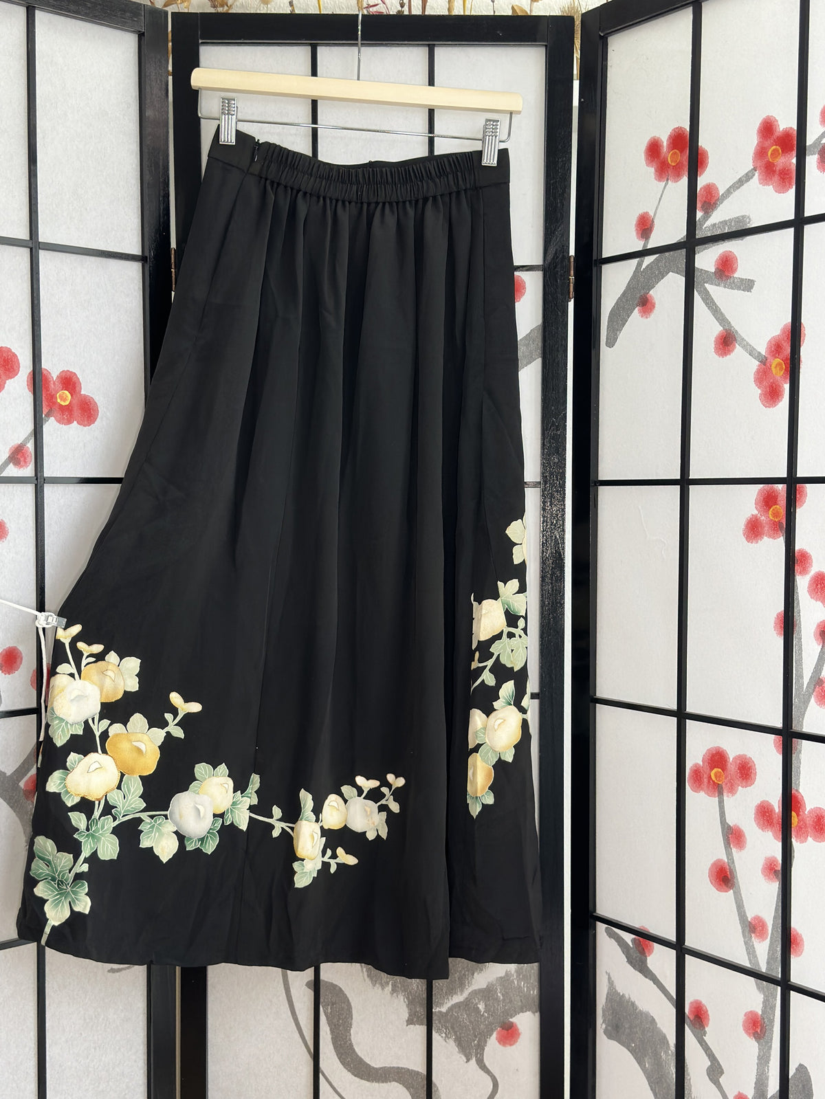 Black kimono skirt with elastic waistband and blossom design, back view