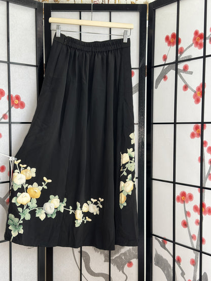 Black kimono skirt with elastic waistband and blossom design, back view