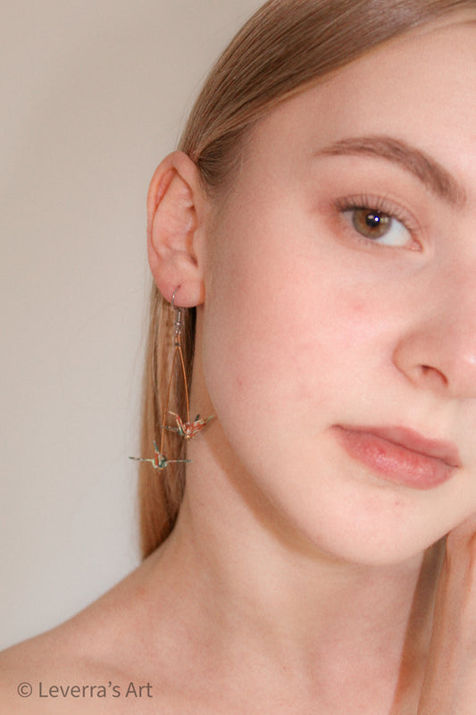 Model wearing the Double mini Crane Origami Earrings