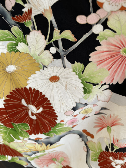 Black kimono dress, detail of red, white and yellow chrysanthemums