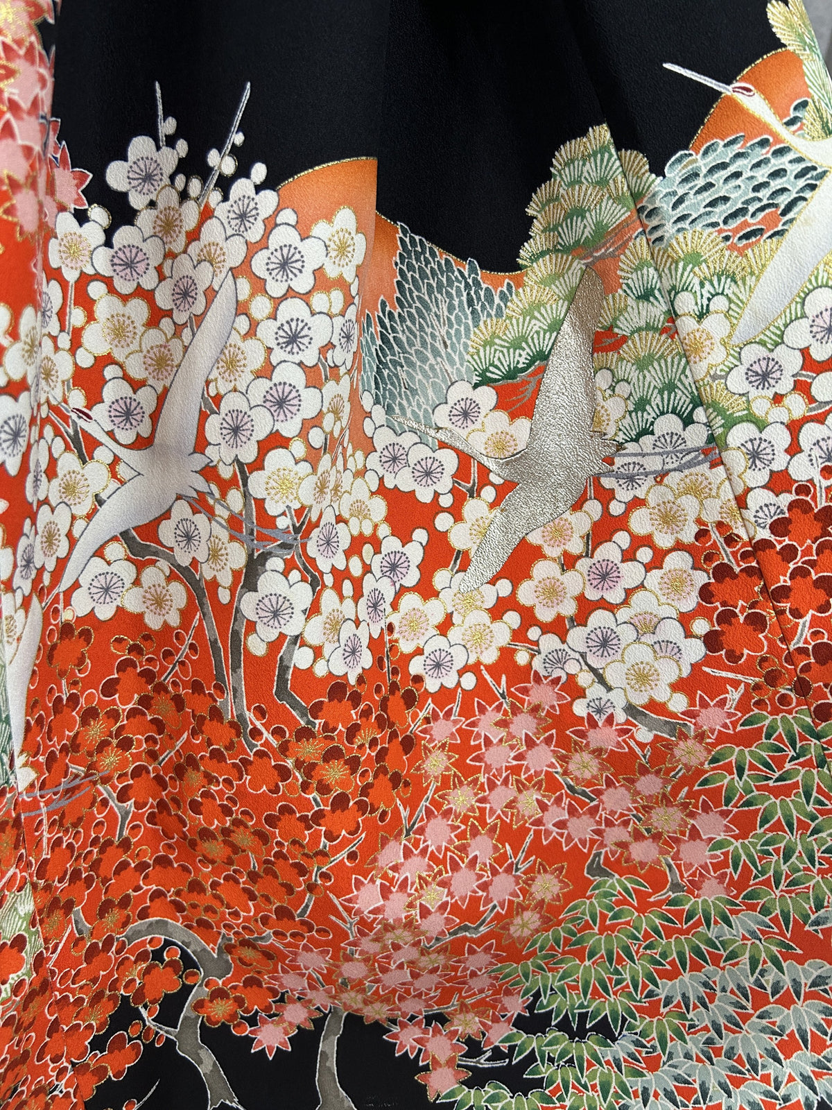 Black upcycled kimono palazzo pants, close-up of white plum blossoms, red maple and waves