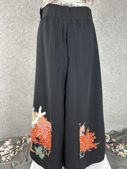 Black upcycled kimono palazzo pants with cranes and red maple at the hem, back view