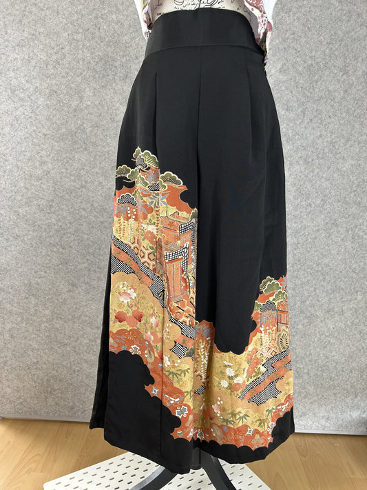 Black upcycled kimono palazzo pants with rust and gold cloud panels of flowers and pine, front view