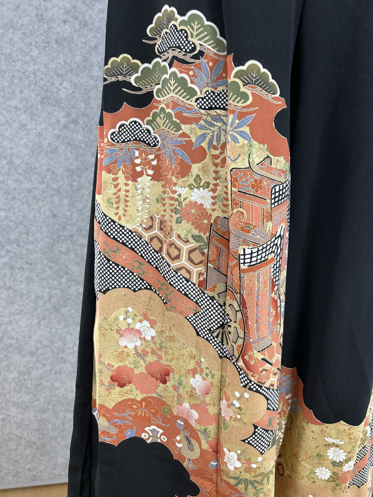 Black upcycled kimono palazzo pants, detail of pine, wisteria and a palace in rust and gold