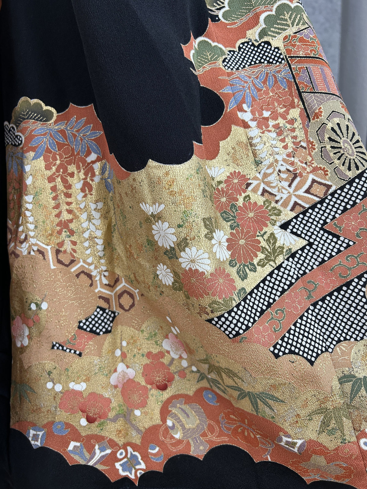 Black upcycled kimono palazzo pants, close-up of chrysanthemums, plum blossoms and lattice bands
