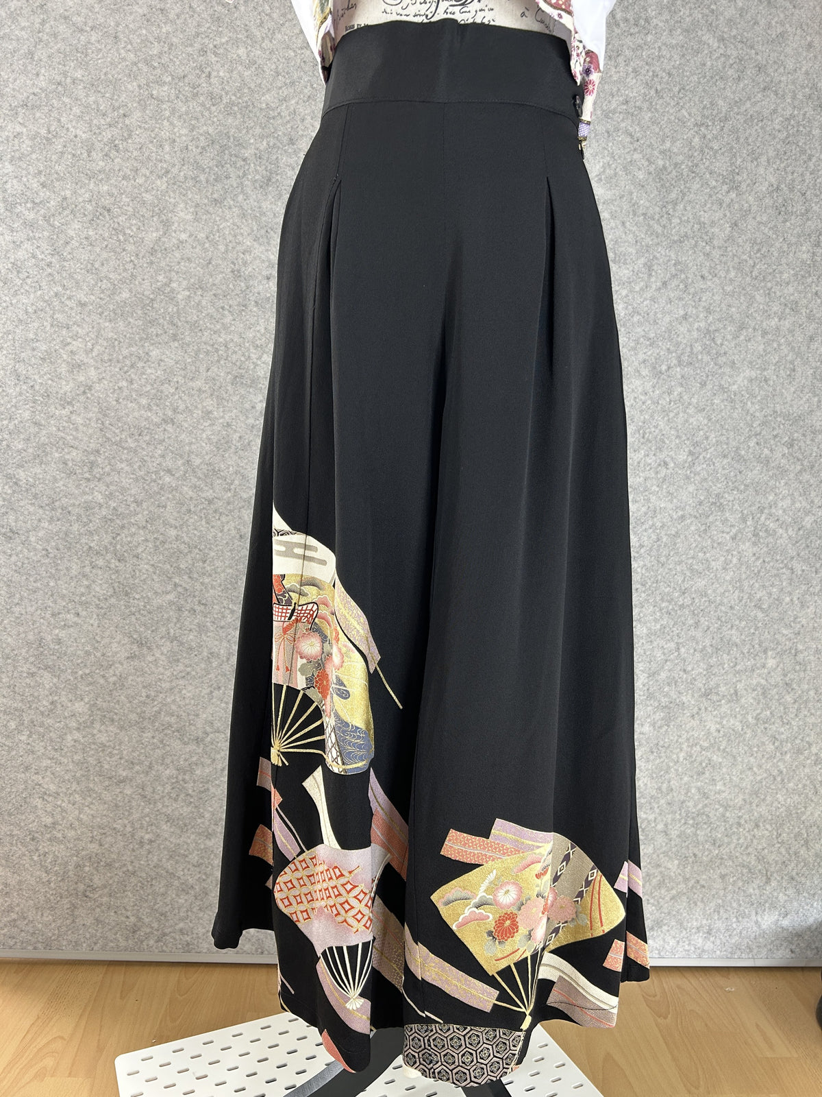 Black upcycled kimono palazzo pants with gold, silver and pink folding fans, front view