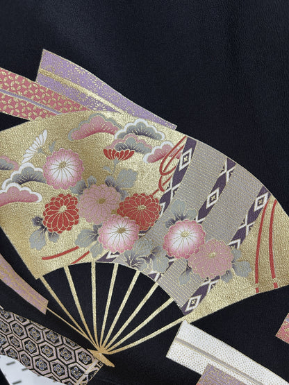 Black upcycled kimono palazzo pants, close-up of a gold fan with pink chrysanthemums and pine