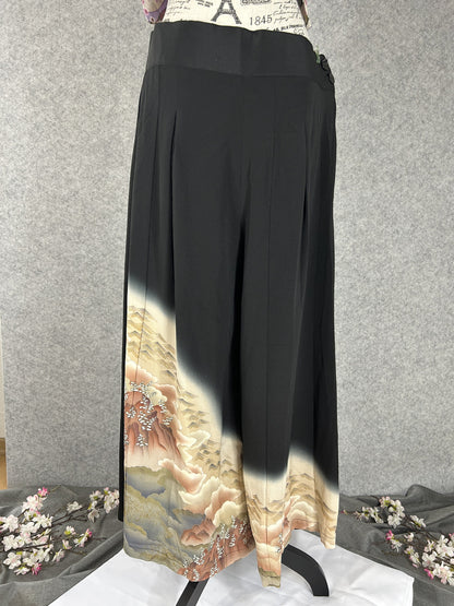 Black upcycled kimono palazzo pants with cream hem, pink clouds and gold rooftops, front view