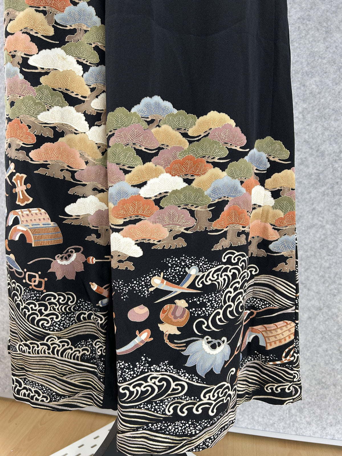 Black upcycled kimono palazzo pants, close-up of tree clusters, a hat, drum and cream waves