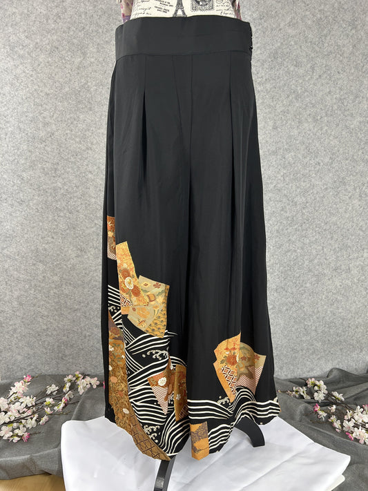 Black upcycled kimono palazzo pants with cream waves and gold chrysanthemum panels, front view