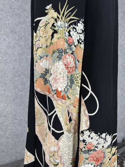 Black upcycled tomesode kimono wide leg pants with peonies, plum blossoms and white cords, detail of the painted peonies on the left leg