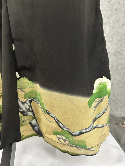 Black upcycled tomesode kimono wide leg pants with a pine tree on gold, close-up of the gold hem with pine branches