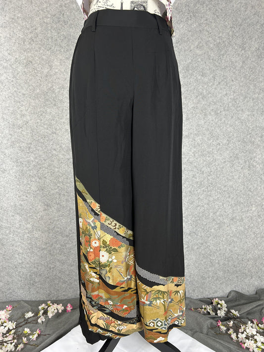 Black upcycled tomesode kimono wide leg pants with gold bands, cranes and chrysanthemums, front view