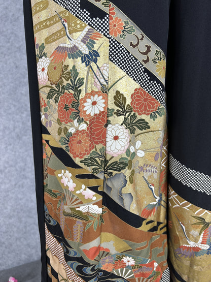 Black upcycled tomesode kimono wide leg pants with gold bands, cranes and chrysanthemums, close-up of the cranes and flowers