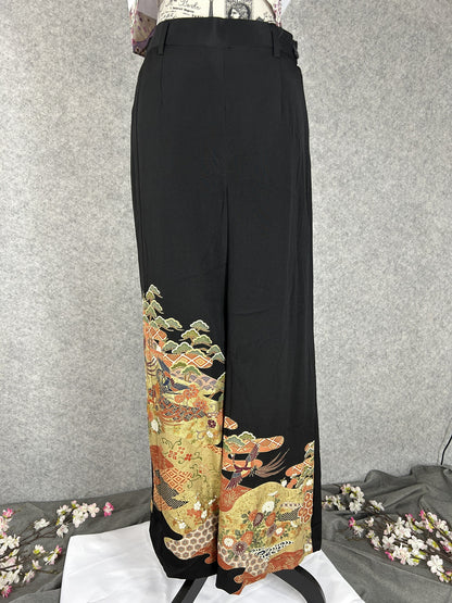 Black upcycled tomesode kimono wide leg pants with birds, gold clouds and pine, front view