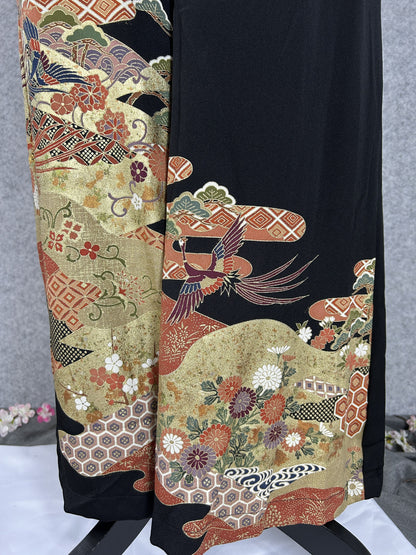 Black upcycled tomesode kimono wide leg pants with birds, gold clouds and pine, close-up of the gold clouds and chrysanthemums