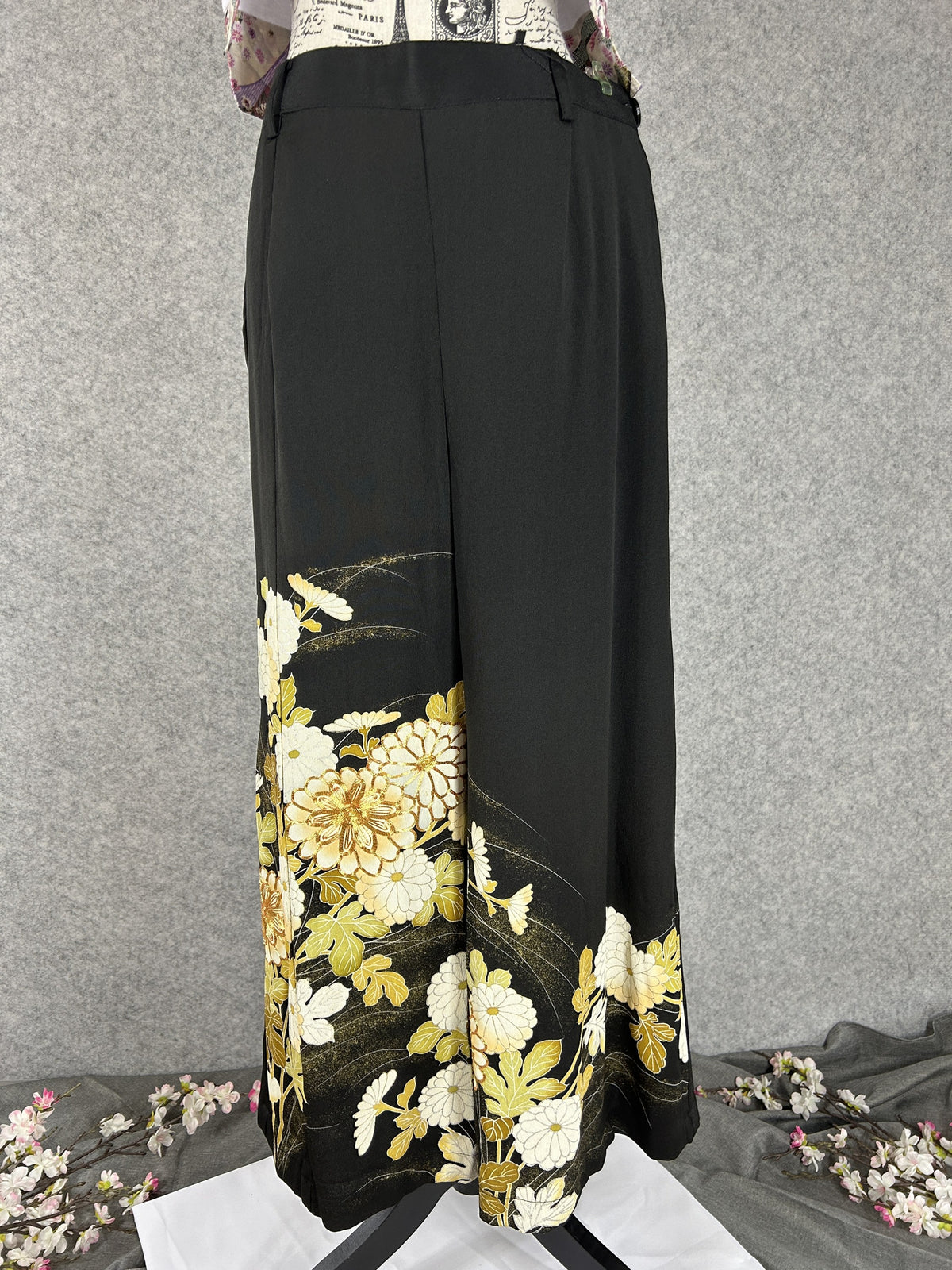 Black upcycled tomesode kimono wide leg pants with white and gold chrysanthemums, front view