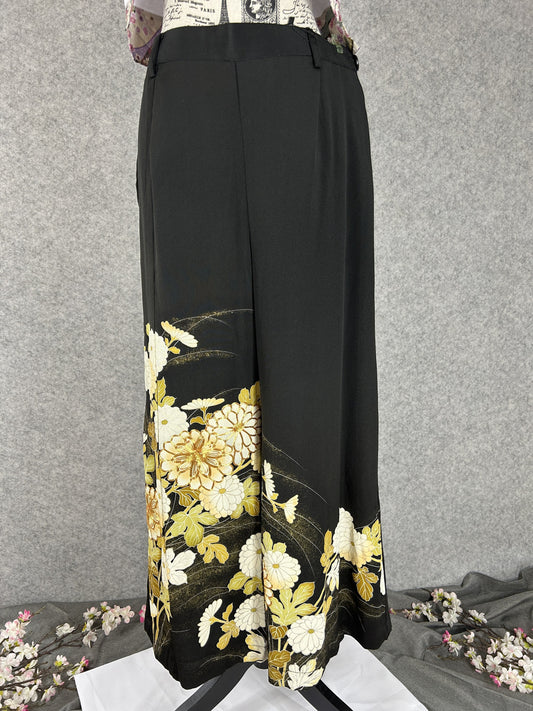 Black upcycled tomesode kimono wide leg pants with white and gold chrysanthemums, front view