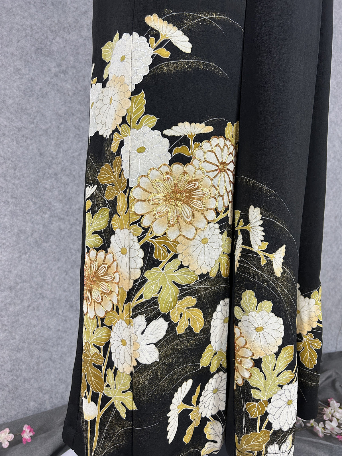Black upcycled tomesode kimono wide leg pants with white and gold chrysanthemums, detail of the chrysanthemums on the left leg