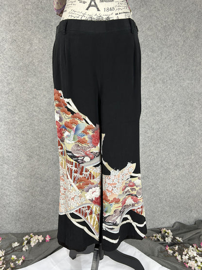 Black upcycled tomesode kimono wide leg pants with mandarin ducks and peonies in fan panels, front view