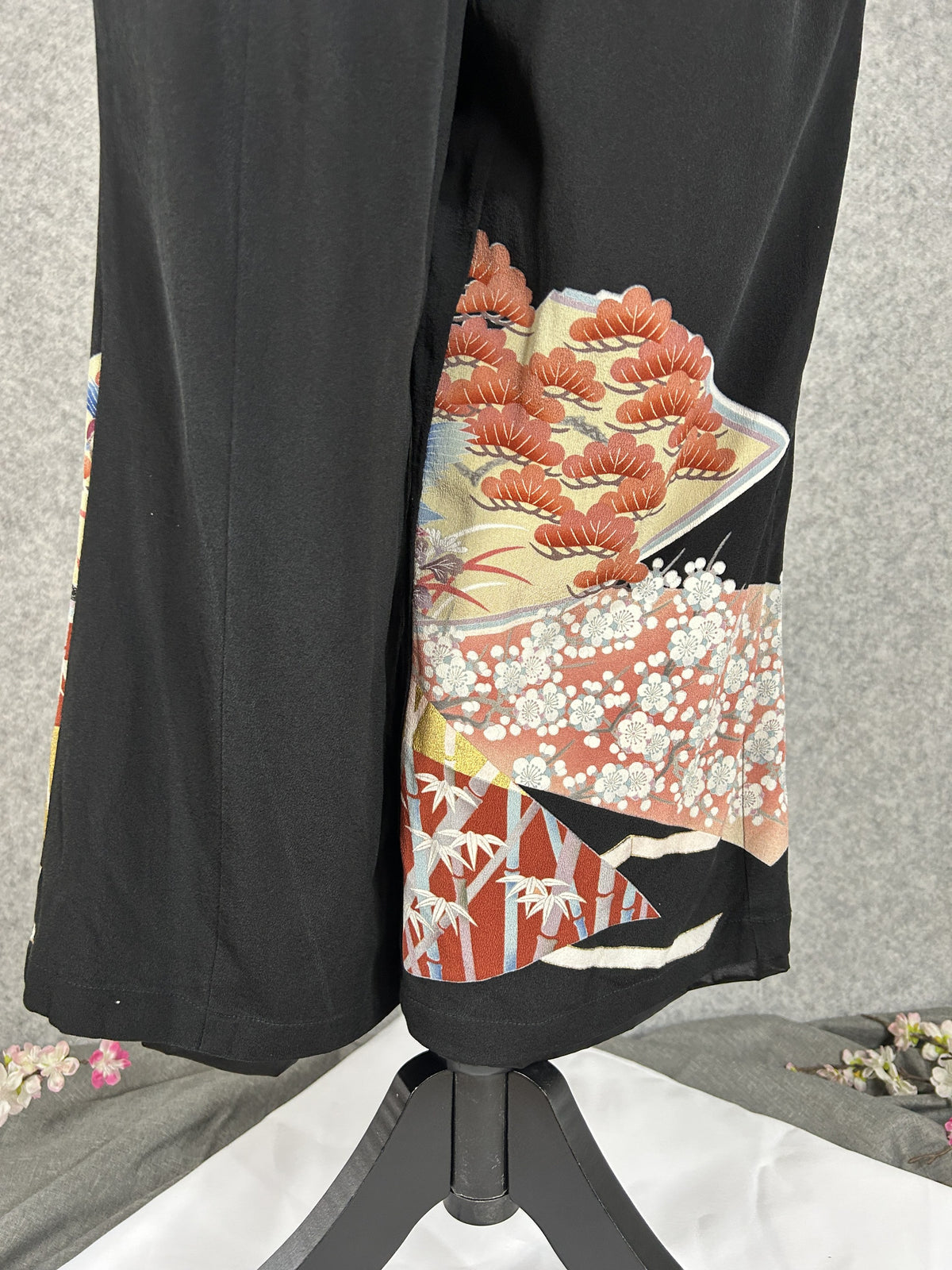 Black upcycled tomesode kimono wide leg pants with mandarin ducks and peonies in fan panels, back view