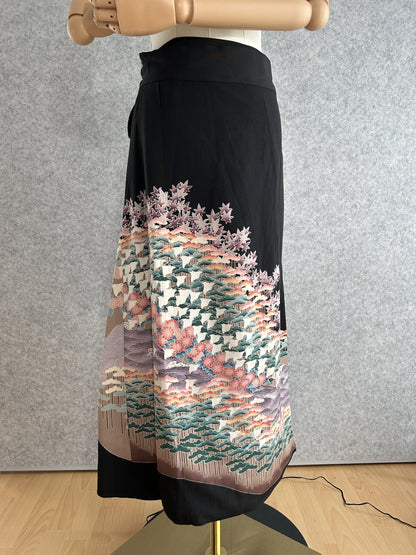 Black kimono wrap skirt with pine tree and maple leaf design at hem, front view