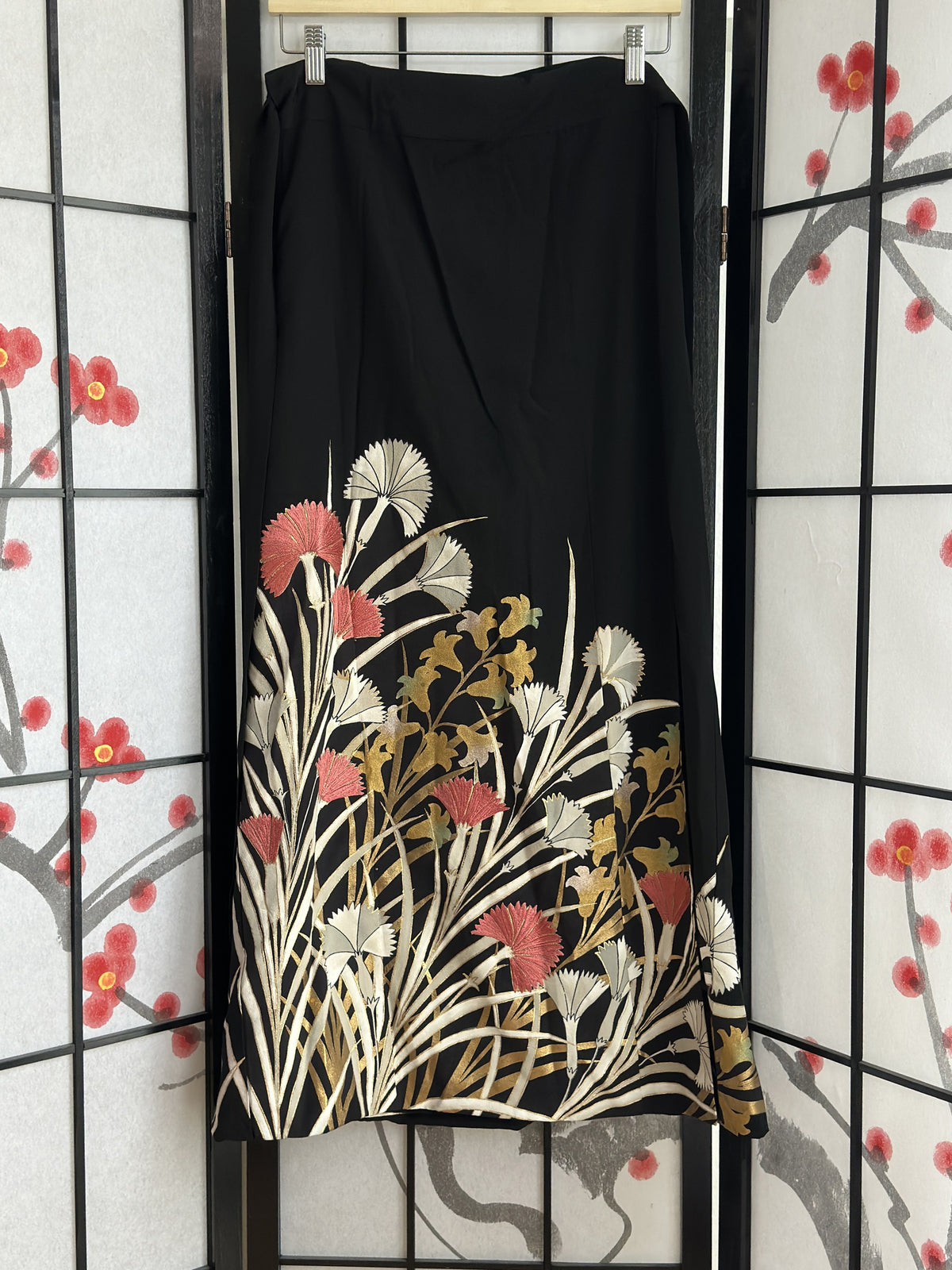 Black kimono wrap skirt with white, pink and gold flowers, front view