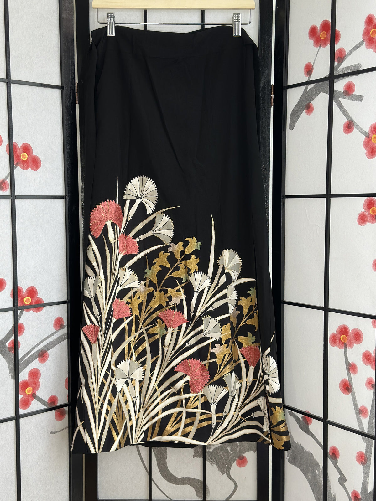 Black kimono wrap skirt with white, pink and gold flowers, full view