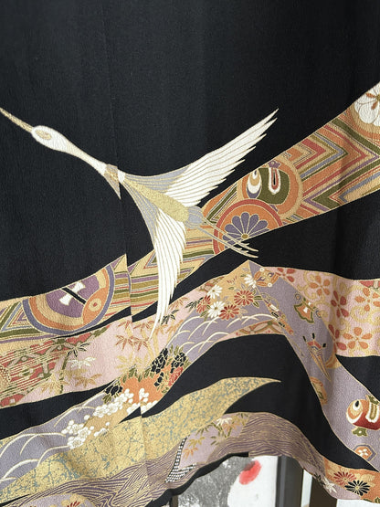 Black kimono wrap skirt, detail of crane and floral bands at hem