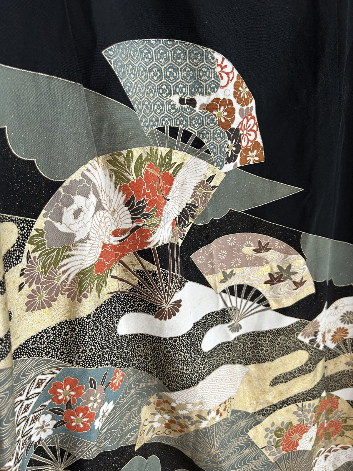 Black kimono wrap skirt, detail of folding fans with red flowers